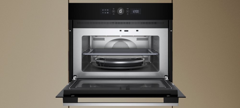 KUCHNIA MIKROFALOWA WHIRLPOOL WMW57DHMX wizualizacja Najważniejsze cechy funkcje 7 stopni mocy kolor czarno-srebrny pojemna komora 40 litrów drzwi otwierane w doł komora ze stali nierdzewnej