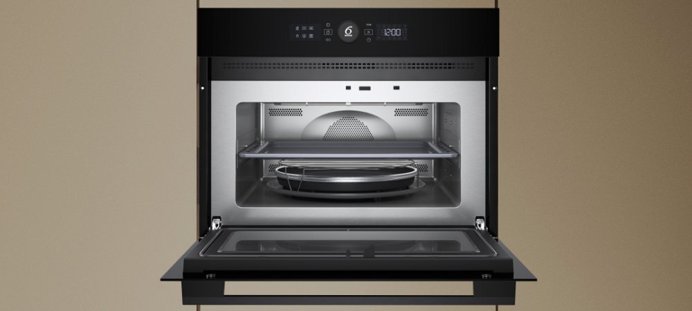 KUCHNIA MIKROFALOWA WHIRLPOOL WMW57DMB wizualizacja Najważniejsze cechy funkcje 7 stopni mocy kolor czarny pojemna komora 40 litrów drzwi otwierane w doł komora ze stali nierdzewnej