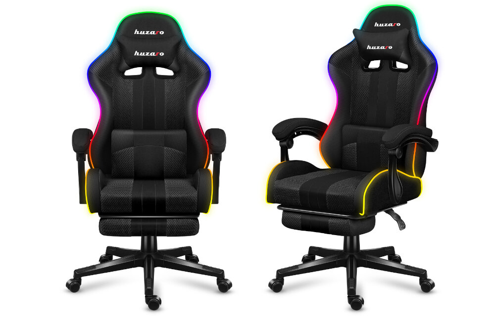 Dwa czarne fotele gamingowe z napisem \'huzaro\' na zagłówkach, posiadające podświetlenie RGB na krawędziach. Fotele mają regulowane podłokietniki i podstawy na kółkach.