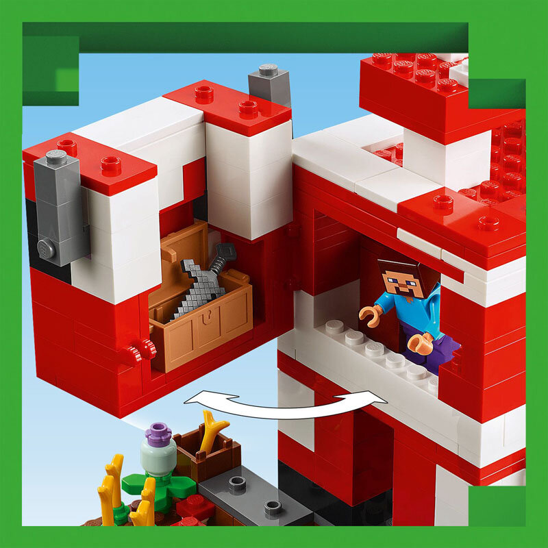 Na obrazie widoczny jest zestaw klocków LEGO przedstawiający konstrukcję z czerwonych i białych elementów, z otwartą ścianą ukazującą wnętrze z brązową skrzynią i narzędziami. Obok znajduje się figurka postaci z niebieskim torsem i fioletowymi nogami, a poniżej widoczna jest strzałka wskazująca na dolną część konstrukcji z roślinami i elementami dekoracyjnymi.