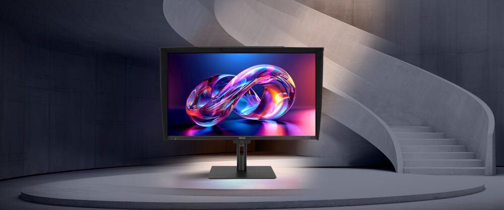 Monitor ASUS ProArt PA32UCE 31.5 cala 3840x2160px IPS prezentacja monitora na podeście w tle schody wpadająca poświata światła
