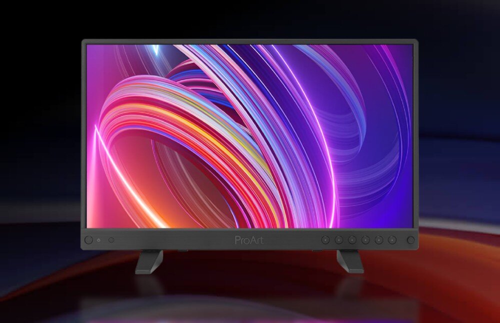 Monitor ASUS ProArt PA16USV monitor ustawiony na dwóch nóżkach na rozmazanym tle, wyświetlający abstrakcyjną grafikę z kolorowymi wstęgami tworzącymi okręgi, kolory, odwzorowanie barw, dokładność