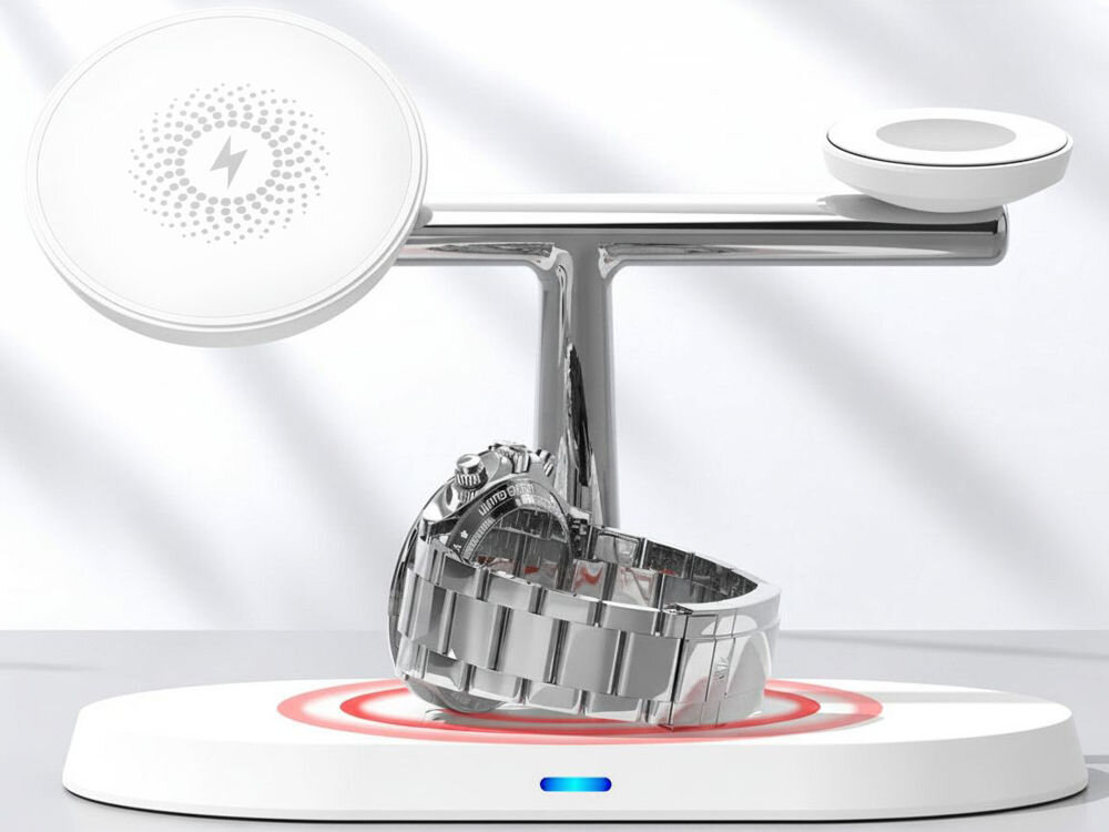 Ładowarka indukcyjna XLINE MagSystem 3w1 Biały Stacja ładująca MagSystem XLine. Na podstawce leży i ładuje się klasyczny, chromowany zegarek z metalową bransoletą. Na ładowarkach smartfona i zegarka widoczne są symbole ładowania bezprzewodowego. [White wireless charging stand with a classic metal wristwatch charging on the base and wireless charging symbols on the pads]