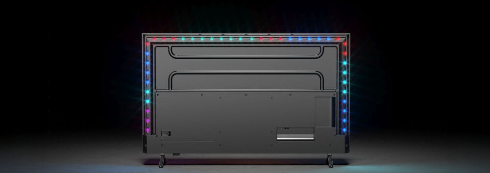 Telewizor PHILIPS 85MLED910 Ambilight podświetlenie LED reagujące na obraz wciągające oglądanie, telewizor stojący tyłem na podłodze