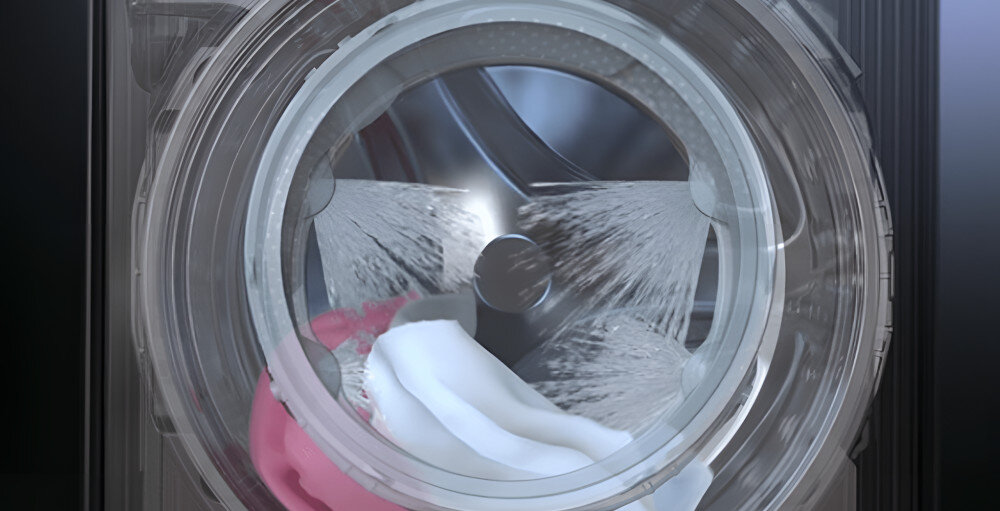 Pralko-suszarka Washtower LG WT1210EGF Bęben pralki LG WashTower w trakcie pracy z efektywnym systemem natrysku wody oraz praniem tkanin.