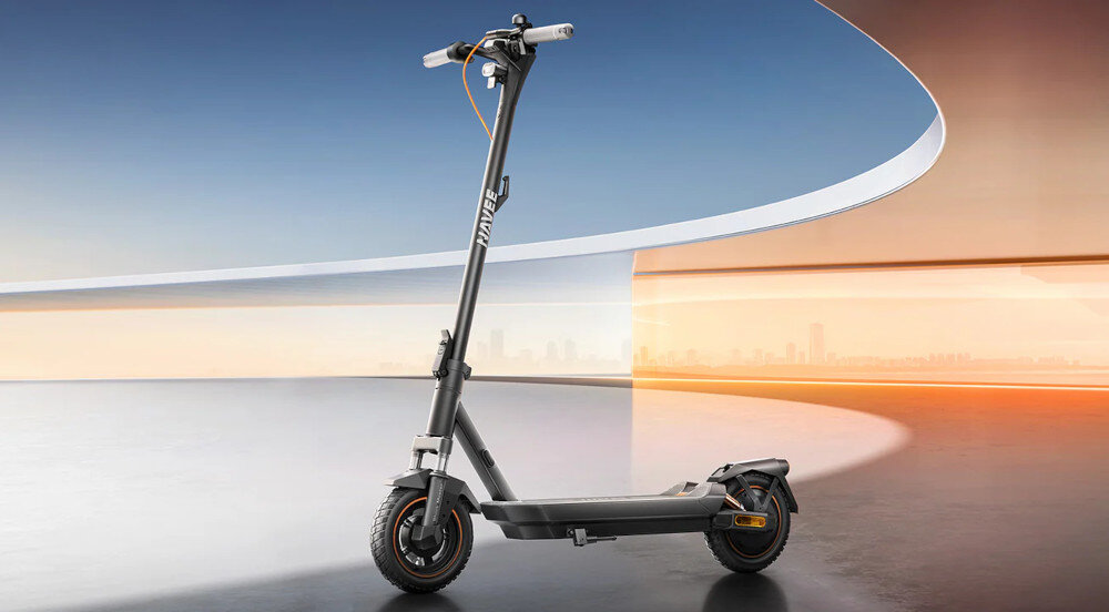 Hulajnoga elektryczna NAVEE GT3 45 km 350W Amortyzacja Czarny 10 cali abstrakcyjne tło hulajnoga widoczna od przodu pod skosem środek transportu mobilność styl stabilność