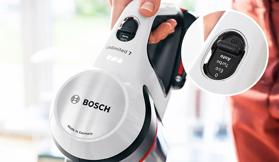 Zdjęcie przedstawia biały odkurzacz marki BOSCH z napisem \'Unlimited 7\' oraz widocznym logo BOSCH i napisem \'Made in Germany\'. W zbliżeniu pokazany jest przełącznik z opcjami \'Turbo\', \'Eco\' i \'Auto\'.