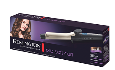 Opakowanie lokówki z napisem \'REMINGTON pro soft curl\' oraz zdjęciem kobiety z kręconymi włosami. Widoczne są także informacje o produkcie i logo REMINGTON.