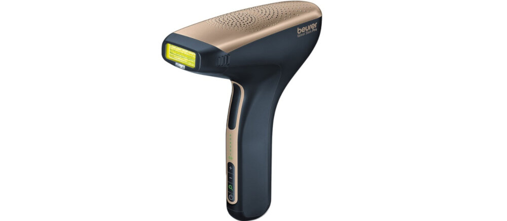 Na obrazie widoczny jest depilator w kolorze czarno-złotym z logo \'beurer\' na górnej części. Urządzenie ma ergonomiczny kształt z panelem kontrolnym na rączce.