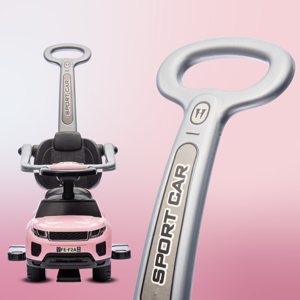 Różowy jeździk z rączką, na której widnieje napis \'SPORT CAR\'. W tle gradient w odcieniach różu.