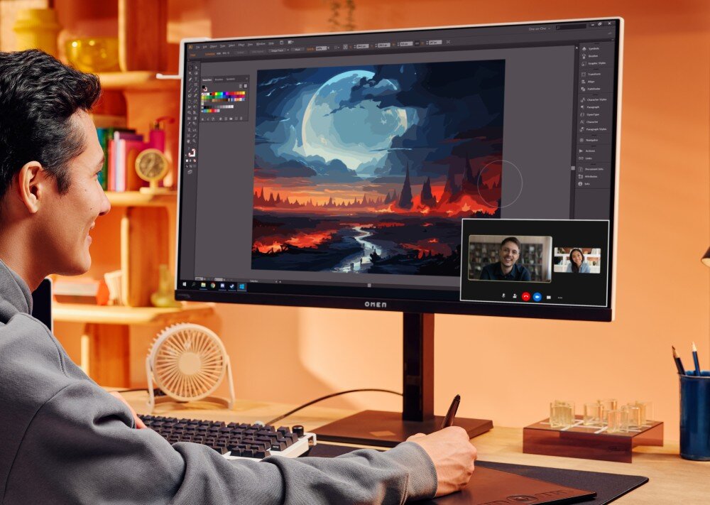 Monitor HP OMEN Transcend 9R181E9 Mężczyzna pracujący przy biurku z rysunkiem cyfrowym na podłączonym monitorze, w prawym dolnym rogu ekranu widać okno rozmowy wideo
