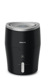Czarny nawilżacz powietrza z logo PHILIPS na przodzie, posiada okrągły panel sterowania na górze i wskaźnik poziomu wody z przodu.