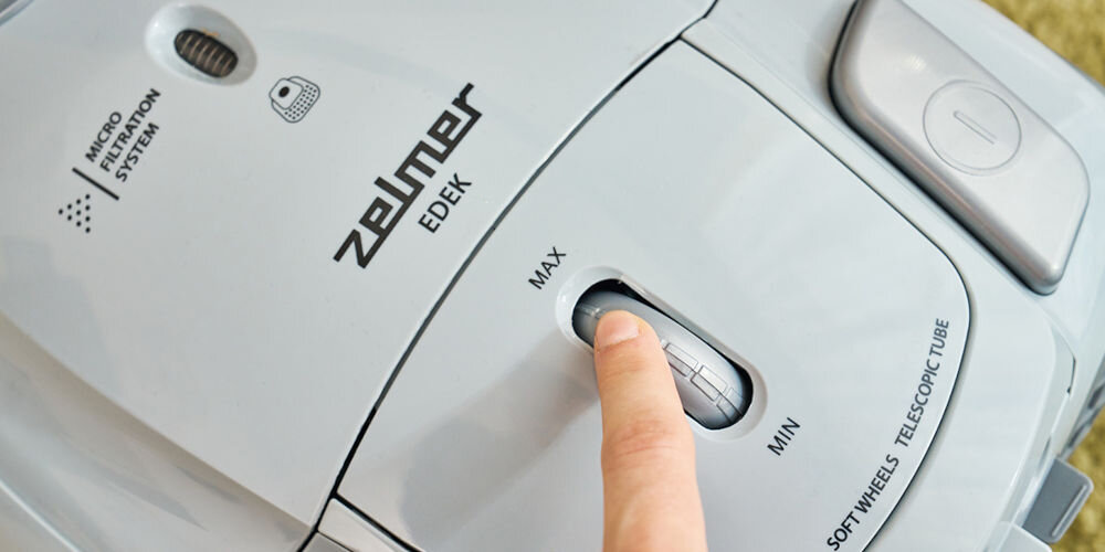 Odkurzacz ZELMER Edek ZVC251 moc 800 W efektywne usuwanie kurzu i brudu regulacja siły ssania łatwe dostosowanie mocy miękkie dywany różne powierzchnie twarde podłogi wszechstronność wygoda czystość skuteczność