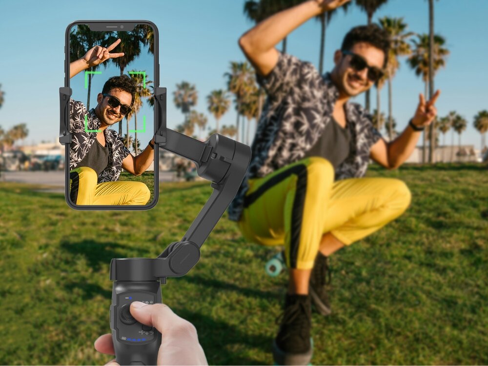 Gimbal MAJESTICLINE AJ Axis AI
stabilizator w dłoni z przymocowanym telefonem robiący zdjęcie tryby pracy follow lock fps moduł ai rozpoznawanie twarzy śledzenie ruchów