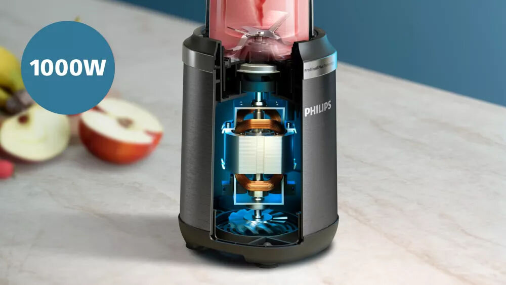 Obraz przedstawia blender kielichowy z widocznym przekrojem ukazującym wnętrze urządzenia. Na niebieskim tle widnieje napis \'1000W\', a na obudowie blendera znajduje się logo \'PHILIPS\'.