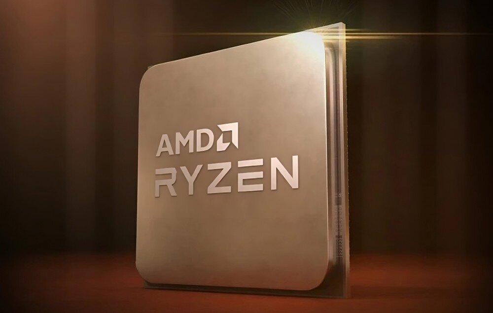 Komputer MAD DOG GeForce RTX5060 DLSS 4 Reflex Edition 2 Powered by Gigabyte AORUS301-A18DR16 Obraz przedstawia procesor z logo 'AMD Ryzen' na gładkiej, metalicznej powierzchni w lekko złotej poświacie, procesor, rdzenie, taktowanie