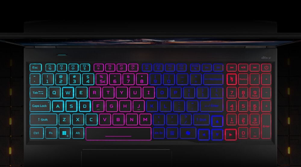 Klawiatura laptopa Acer Nitro z czterostrefowym RGB podświetleniem w kolorach cyan fioletowym niebieskim i czerwonym na czarnym tle z żółtymi akcentami  - Klawiatura z 4-strefowym podświetleniem RGB