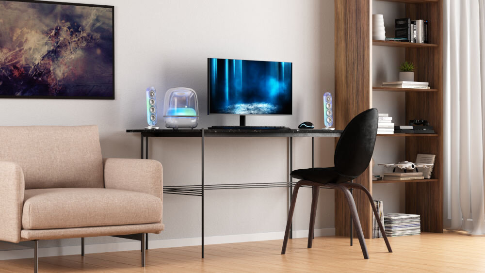 Głośnik HARMAN KARDON Soundstick 5 subwoofer skierowany w dół bas, zestaw kolumn sotjący na biurku obok monitora