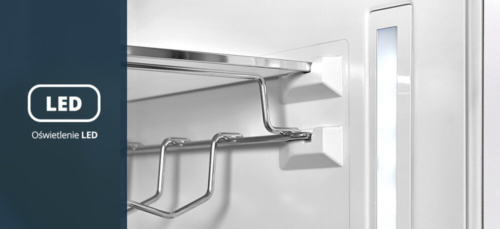 Lodówka VESTFROST VR-BB27633H0DD Na zdjęciu widać fragment wnętrza drzwi z chromowanym uchwytem na butelki. Obok niego znajduje się pionowy pasek oświetlenia LED podkreślający jasne wnętrze lodówki Energooszczędne światło LED z góry i boków zapewnia doskonałą widoczność wnętrza