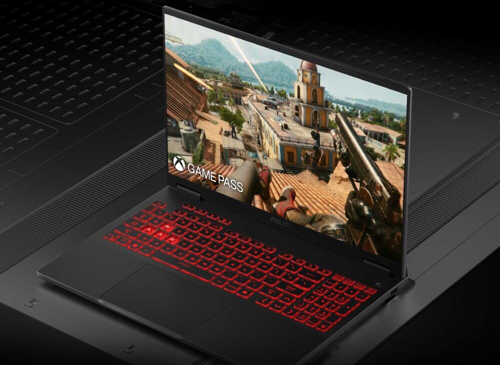 Laptop ASUS TUF Gaming z ekranem prezentującym dynamiczną rozgrywkę i logo Game Pass, podświetlana klawiatura RGB, design dla graczy. - Opis serii TUF Gaming 