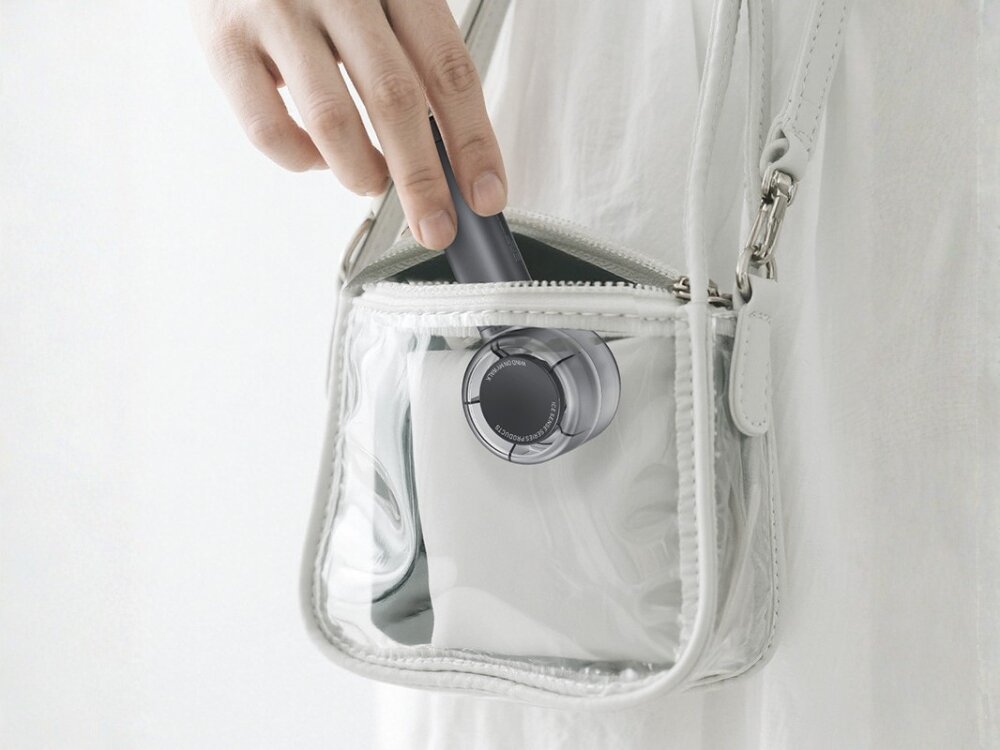 Wentylator USAMS LiFE LU01 wentylator bateria Dłoń wkładająca kompaktowy, szary wentylator z uchwytem do przezroczystej torebki typu shopper.