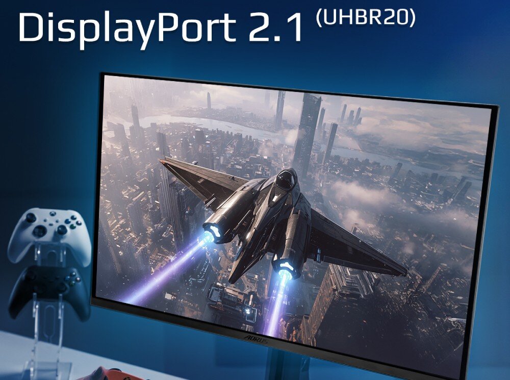 Monitor GIGABYTE Aorus FO27Q5P Monitor wyświetlający samolot bojowy nad miastem, na górze widnieje napis DisplayPort 2.1 (UHBR20), obok stoi kontroler do gier