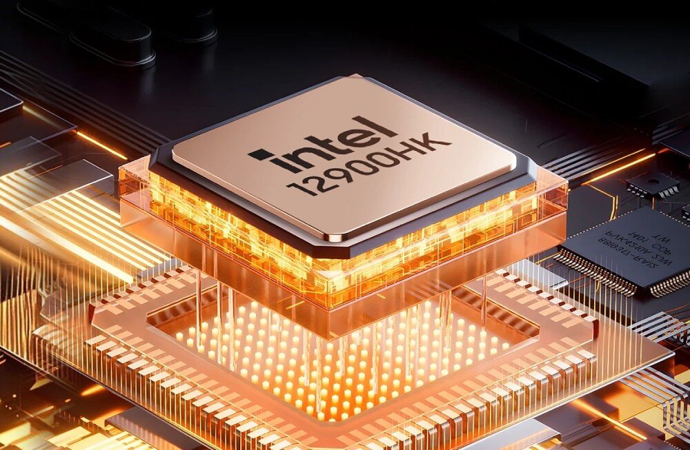 Komputer BLACKVIEW MP100 Pro Zbliżenie na procesor z logo 'Intel' zamontowany na płycie głównej, otoczony świecącym, pomarańczowym światłem symbolizującym energię, procesor, rdzenie, wątki