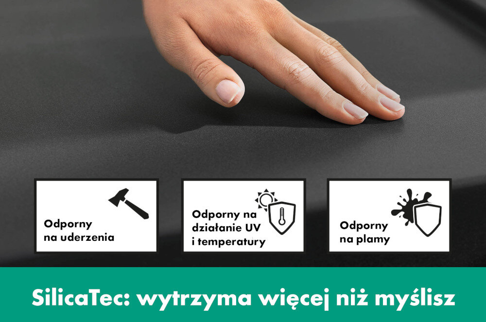 Na obrazie widoczna jest dłoń dotykająca czarnej powierzchni z trzema ikonami: młotek z napisem \'Odporny na uderzenia\', słońce z termometrem z napisem \'Odporny na działanie UV i temperatury\', oraz tarcza z plamą z napisem \'Odporny na plamy\'. Na dole znajduje się tekst: \'SilicaTec: wytrzyma więcej niż myślisz\'.