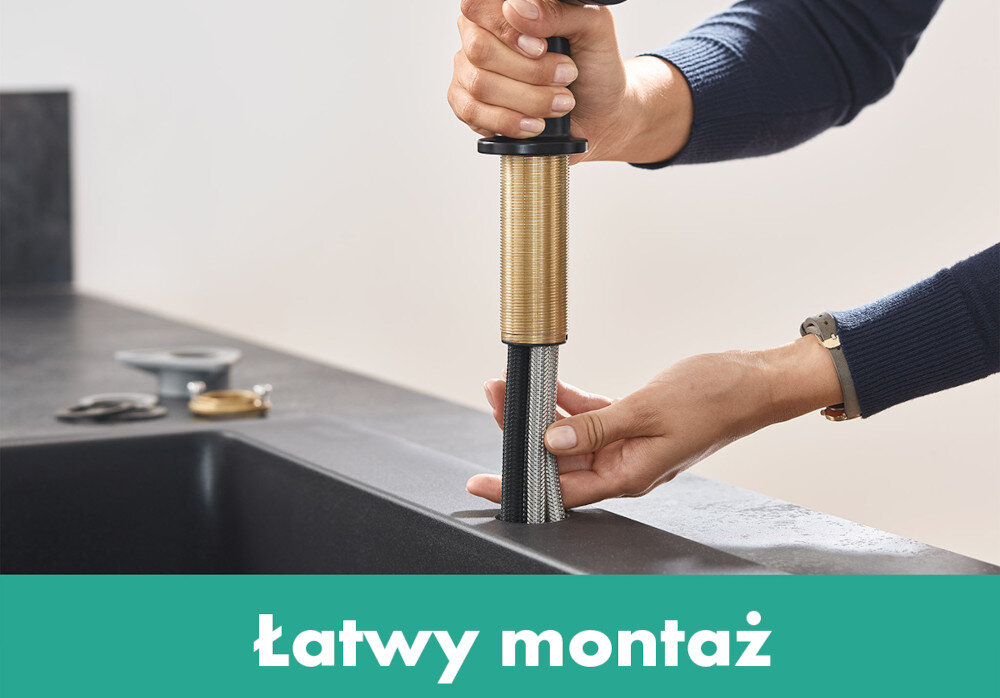 Osoba montuje element baterii w blacie kuchennym. Na dole obrazu znajduje się napis \'Łatwy montaż\'.