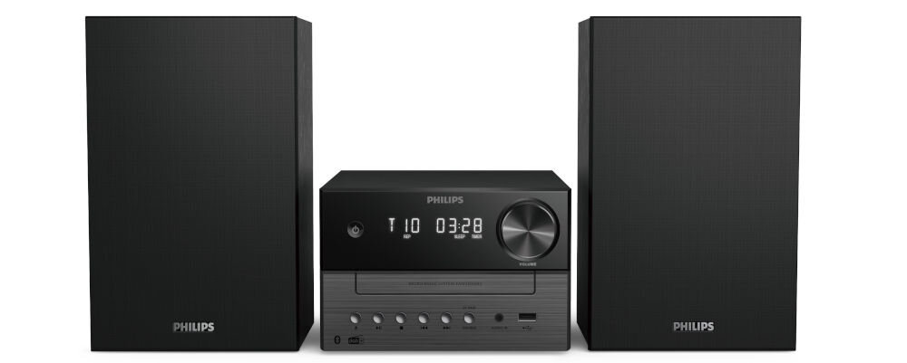 Na obrazie widoczna jest czarna wieża audio z dwoma głośnikami. Na centralnej jednostce znajduje się wyświetlacz z napisem \'T 10 03:28\' oraz kilka przycisków i pokręteł.