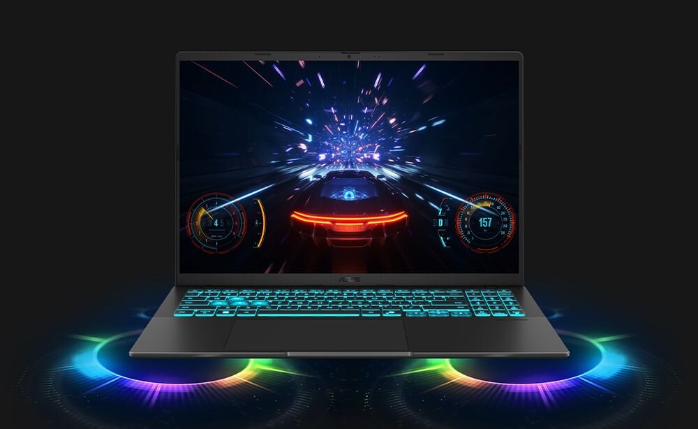 ptop ASUS V16 z kolorowym RGB podświetleniem podstawy wyświetlającym grę wyścigową z efektami cząstek na ekranie na czarnym tle - System audio Dirac