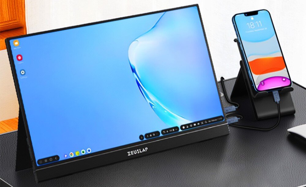 Monitor ZEUSLAP ZP156K Monitor połączony ze smartfonem stojącym na podstawce, na ekranie widoczny interfejs w jasnych barwach, porty, zasilanie, podłączenie