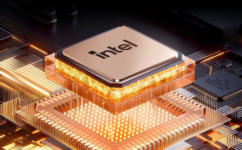 Komputer BLACKVIEW MP100 Pro Zbliżenie na procesor z logo 'Intel' zamontowany na płycie głównej, otoczony świecącym, pomarańczowym światłem symbolizującym energię, procesor, rdzenie, wątki