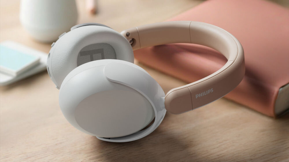 Słuchawki nauszne PHILIPS TAK5500RT 60 godzin pracy bateria szybkie ładowanie USB-C jack 3,5 mm, słuchawki oparte o książkę leżącą na biurku