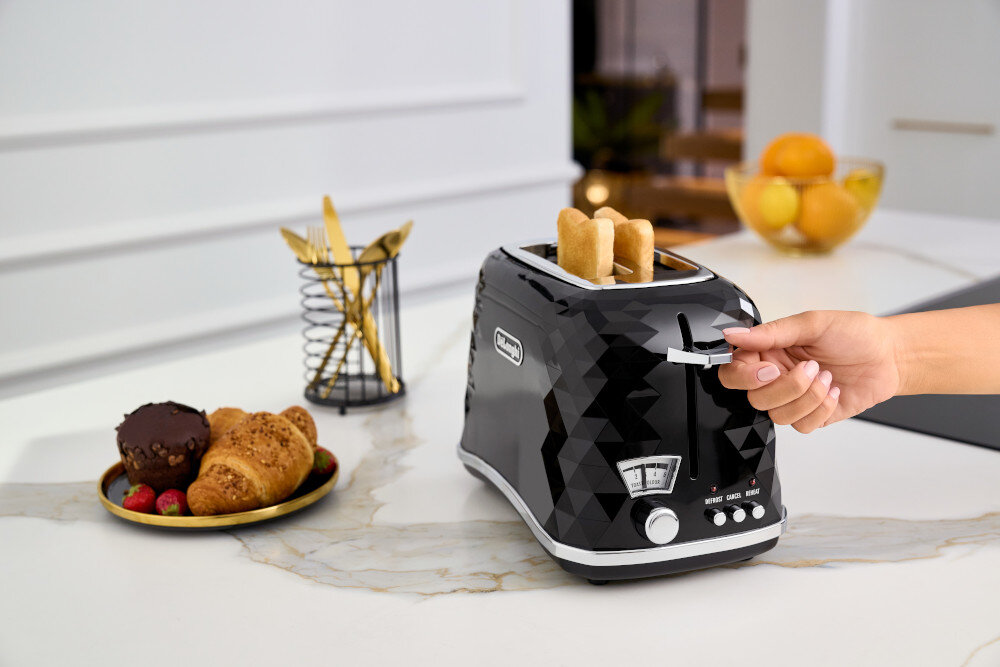 Toster DELONGHI Brillante CTJ 2103.BK Funkcja Extra-Lift ruszt podgrzewanie bułki rogaliki