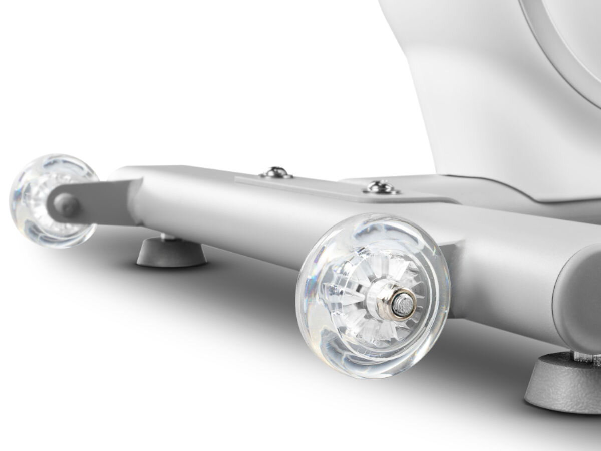 Rower elektromagnetyczny SPOKEY Zen, mobilność, trwałość, ergonomia, praktyczność, Koła transportowe i podstawa roweru stacjonarnego Spokey w kolorze białym.