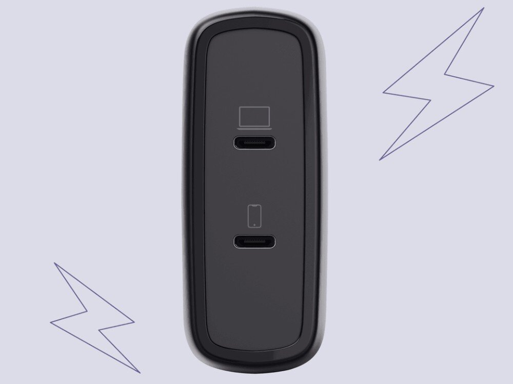 Zasilacz do laptopa TRUST Maxo 25527 100W Czarny ładowarka ścienna z dwoma portami USB-C z ikonami laptopa i smartfona, otoczona graficznymi symbolami błyskawic na jasnym tle