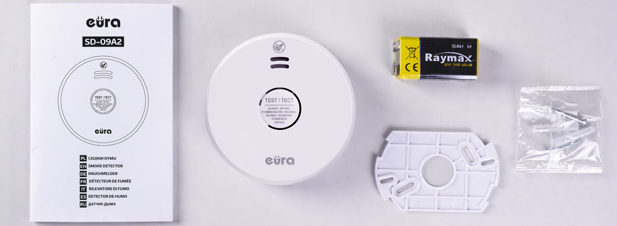Czujnik dymu EURA SD-09A2, zawartość, zestaw, opakowanie, komplet, Zawartość zestawu EURA SD-08A2: czujnik, bateria, uchwyt i instrukcja.