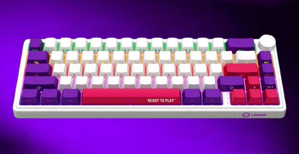 Klawiatura mechaniczna z kolorowymi klawiszami, w tym białymi, fioletowymi i czerwonymi, z napisem \'READY TO PLAY\' na klawiszu spacji. Logo \'LORGAR\' widoczne w prawym dolnym rogu obudowy.