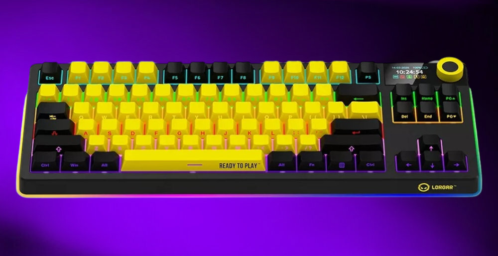 Klawiatura mechaniczna z żółtymi i czarnymi klawiszami, z napisem \'READY TO PLAY\' na spacji. Widoczne logo \'LORGAR\' w prawym dolnym rogu.