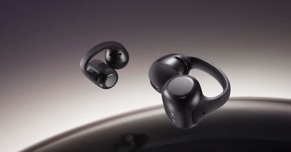 SHOKZ OpenDots One kompaktowe etui klips lekkość stabilność, słuchawki powietrzne na ciemnym tle