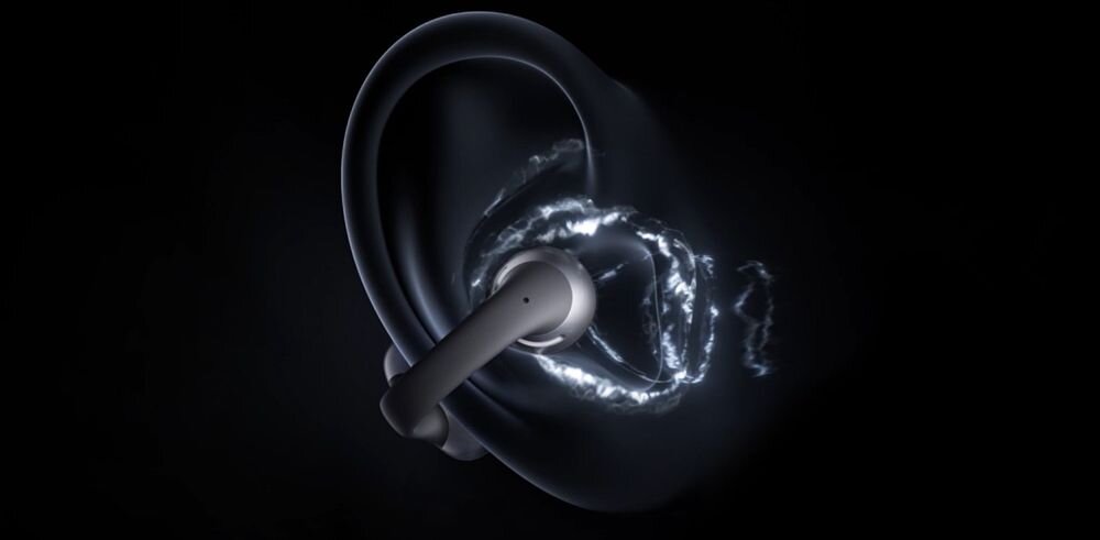 SHOKZ OpenDots One DirectPitch precyzyjny dźwięk minimalny wyciek prywatność, wizualizacja słuchawki włożonej do ucha