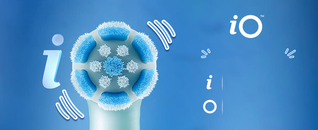 Gra słów z 'iO' pokazująca literę I i używająca główki szczoteczki jako litery O, natomiast fale przedstawiają wibracje.