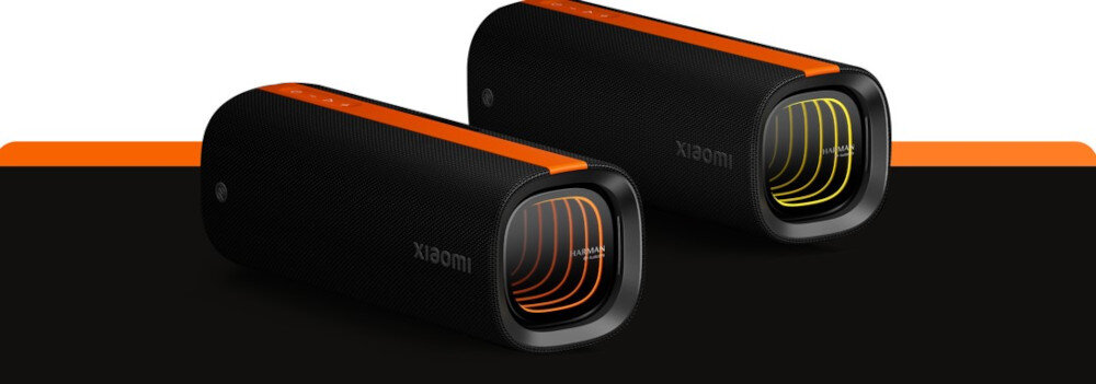 Głośnik mobilny XIAOMI Sound Party, głębokie basy i 360 stopni rozchodzenia się dźwięku, głośniki stojące po skosie na biało pomarańczowo czarnym tle