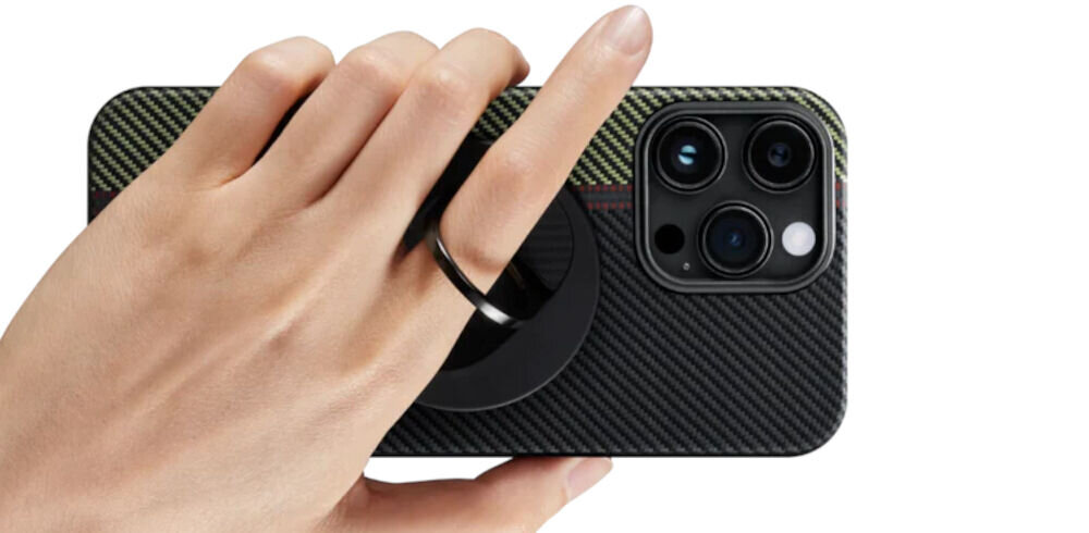 Uchwyt i podstawka PITAKA MagEZ Grip 3 MagSafe Czarno-szary telefon trzymany w dłoni palec przełożony przez uchwyt białe tło Uchwyt MagSafe pełniący funkcję podstawki – orientacja pionowa i pozioma stabilna konstrukcja ergonomiczny chwyt capture button