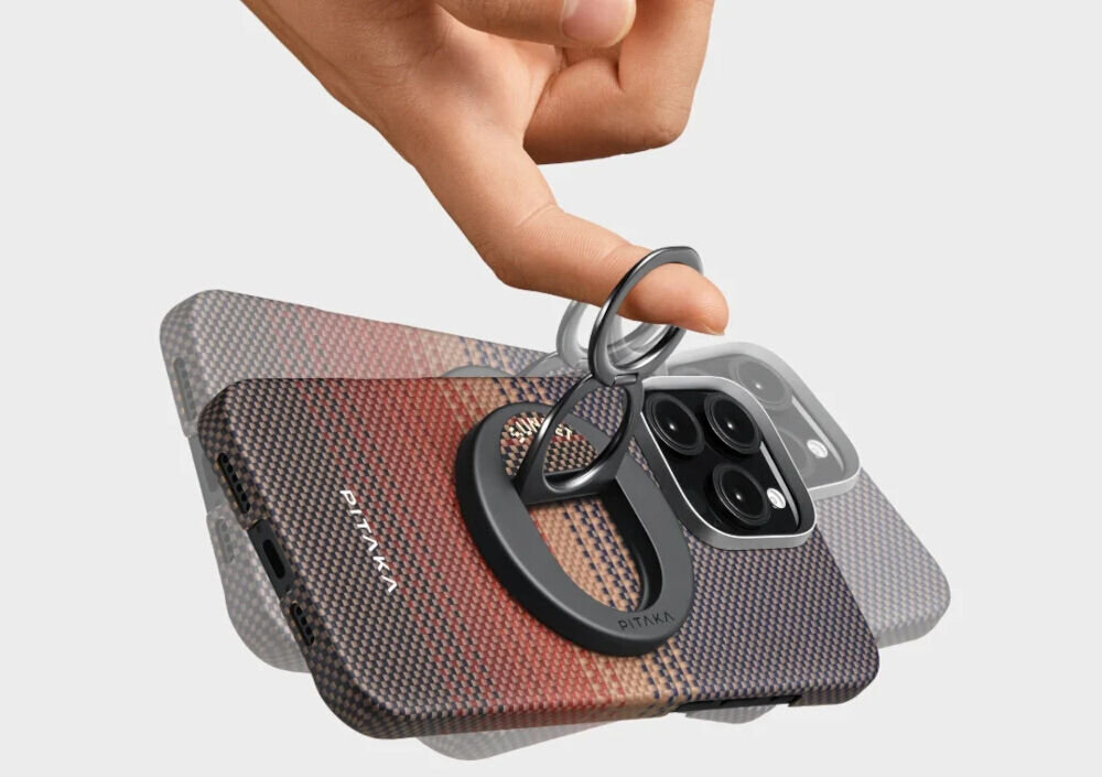 Uchwyt i podstawka PITAKA MagEZ Grip 3 MagSafe Czarno-brązowy prezentacja uchwytu przyczepionego do telefonu palec przełożony przez uchwyt wizualizcja potrząsania telefonem Aramidowa konstrukcja i cienki profil uchwytu MagSafe waga grubość konstrukcja 2-pierścieniowa odpowiedni chwyt