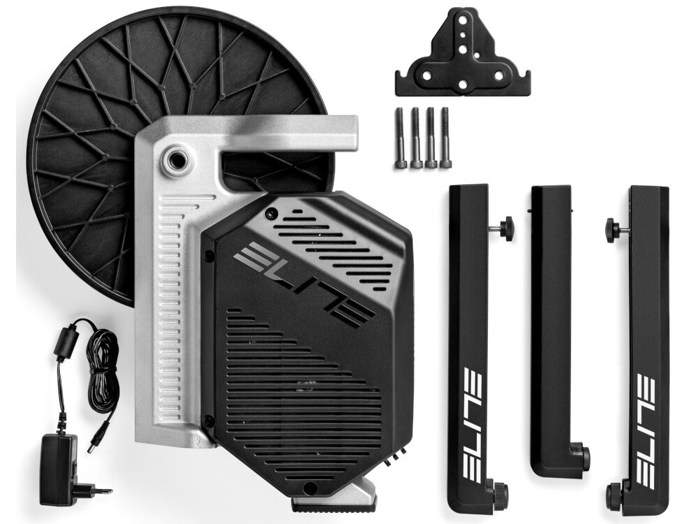 Trenażer rowerowy ELITE Rivo EL0241001 zestaw na białym tle w zestawie trenażer 4 śruby 3 odkręcane nogi trójnik do nóg kabel zasilający dokumentacja