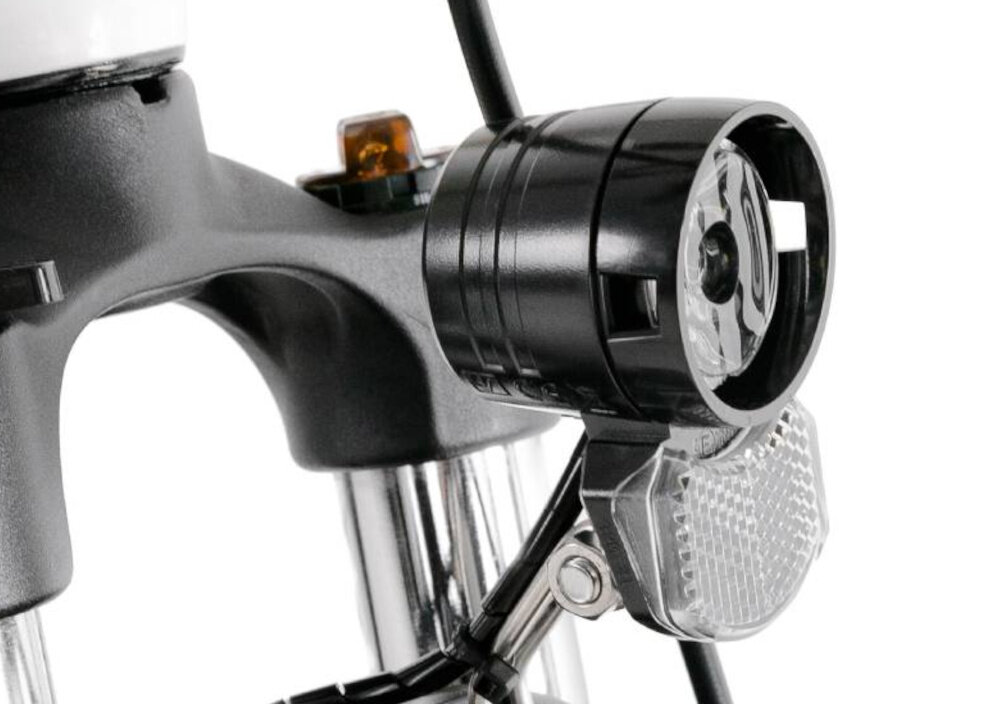 Rower elektryczny PROECO Wave AN 1.0 M19 28 cali Biały zbliżenie na przednie światło bezpieczeństwo zintegrowane przednie światło i tylne oświetlenie dobra widoczność bezpieczeństwo