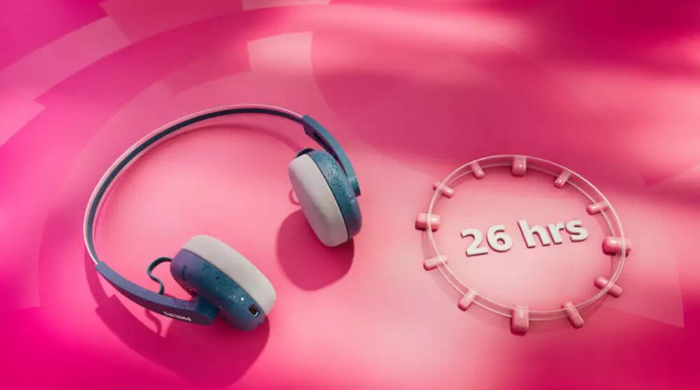 Słuchawki PHILIPS TAH2000TL/00 USB-C szybkie ładowanie i długa praca baterii, słuchawki leżące na różowym podłożu