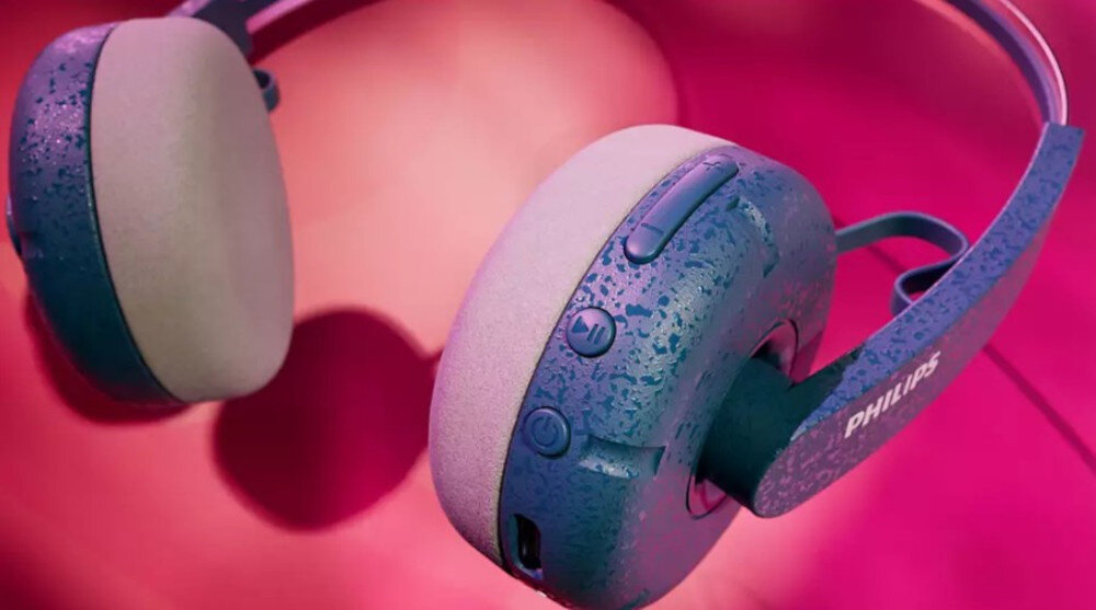 Słuchawki PHILIPS TAH2000TL/00 przyciski sterowania muzyką i połączeniami, słuchawki po skosie na różowym tle